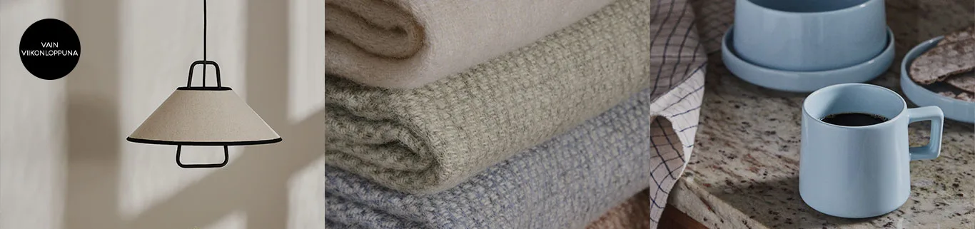 Riippuvalaisin, pino beigenvärisiä peittoja ja vaaleansininen kahvimuki työtasolla. Vain viikonloppuna.