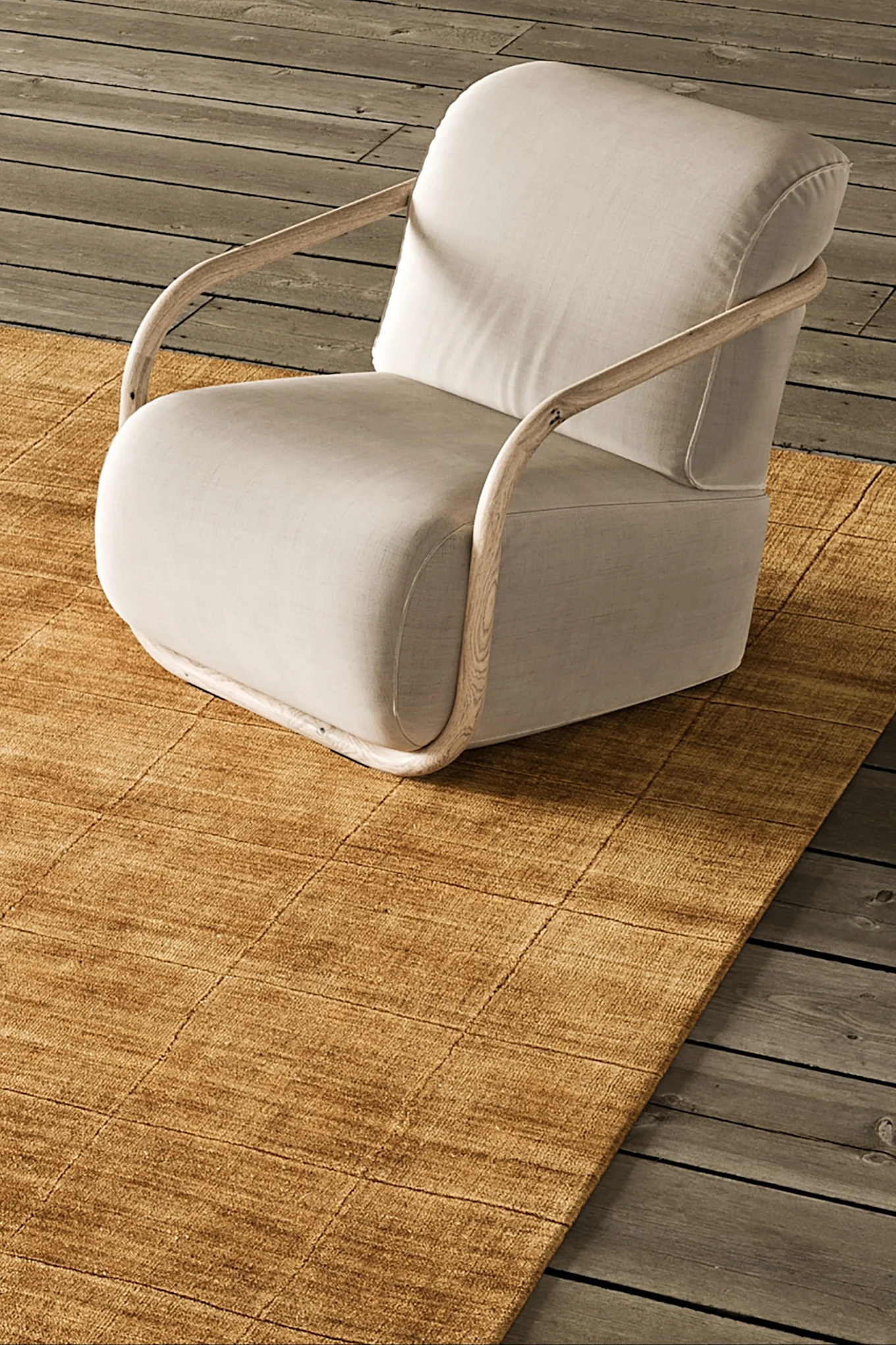 Kuvassa on Hem-tuolien Hunk-nojatuoli tummanruskeana, joka heijastaa vuoden 2026 sisustuksen värisuuntauksia.